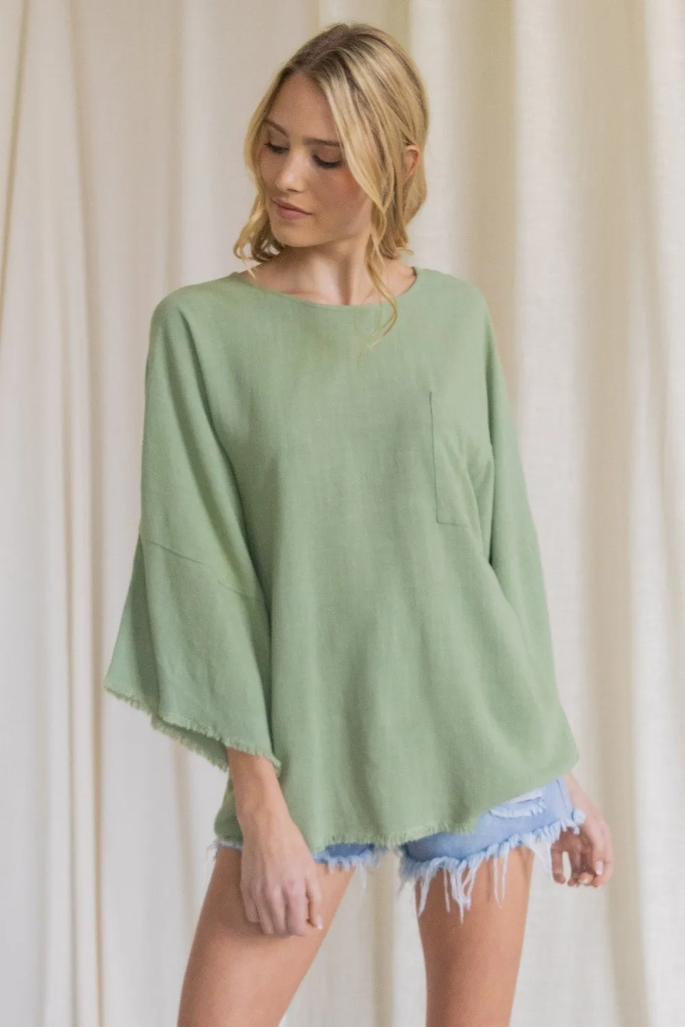 Oversized front pocket linen raw edge top