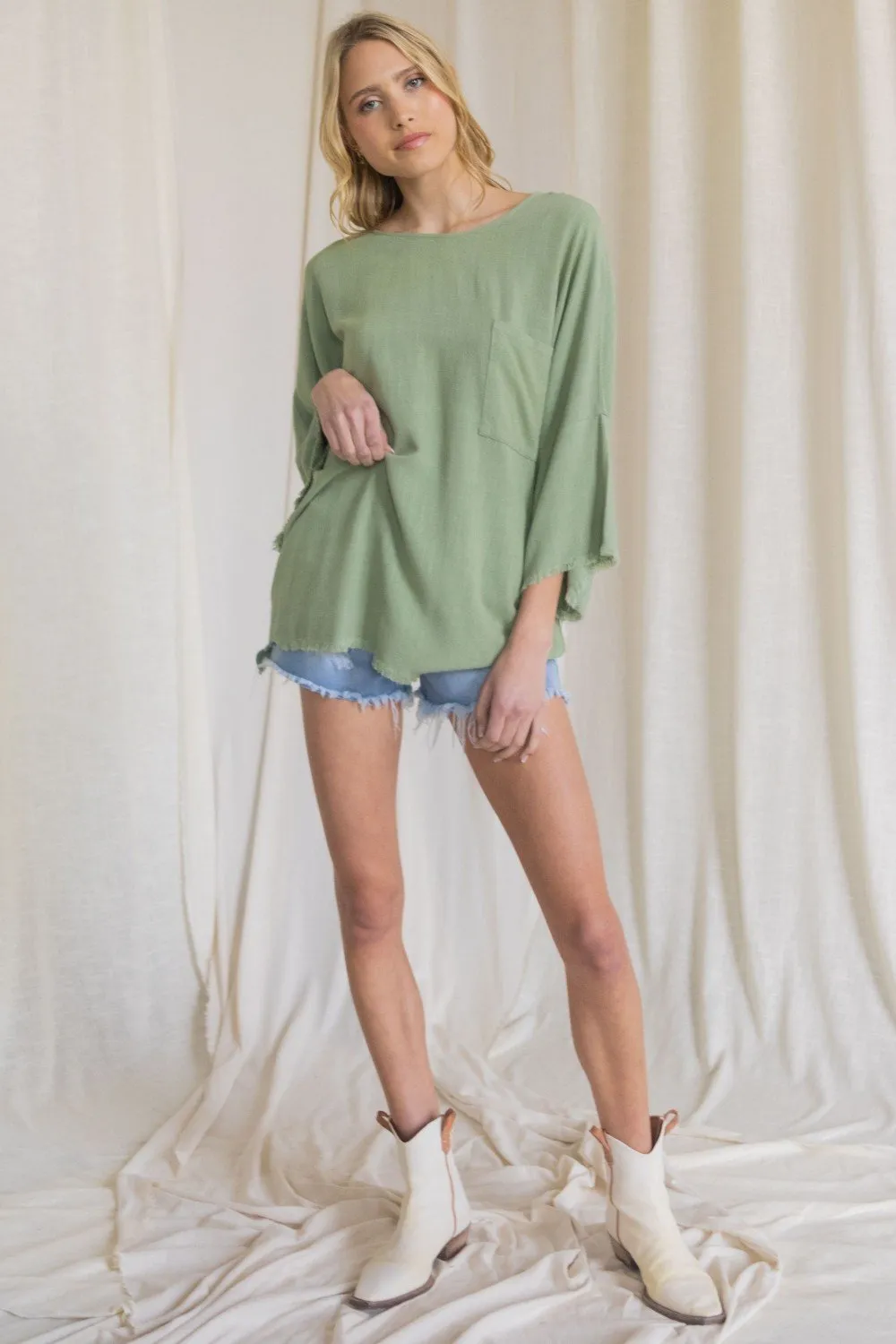 Oversized front pocket linen raw edge top