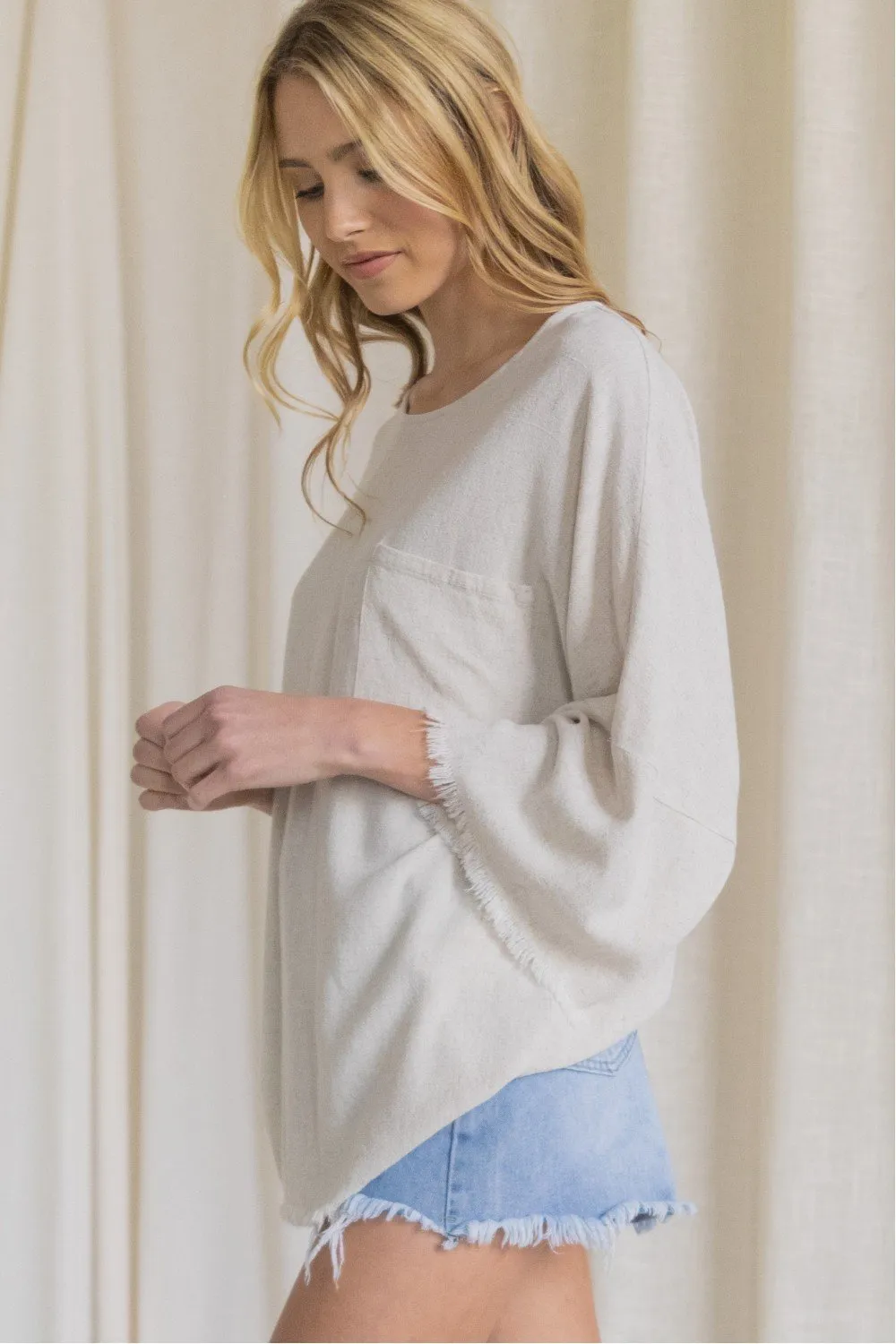 Oversized front pocket linen raw edge top