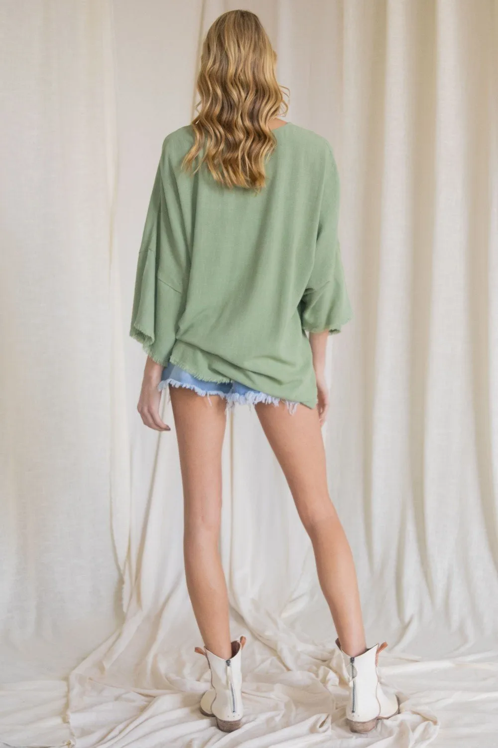 Oversized front pocket linen raw edge top